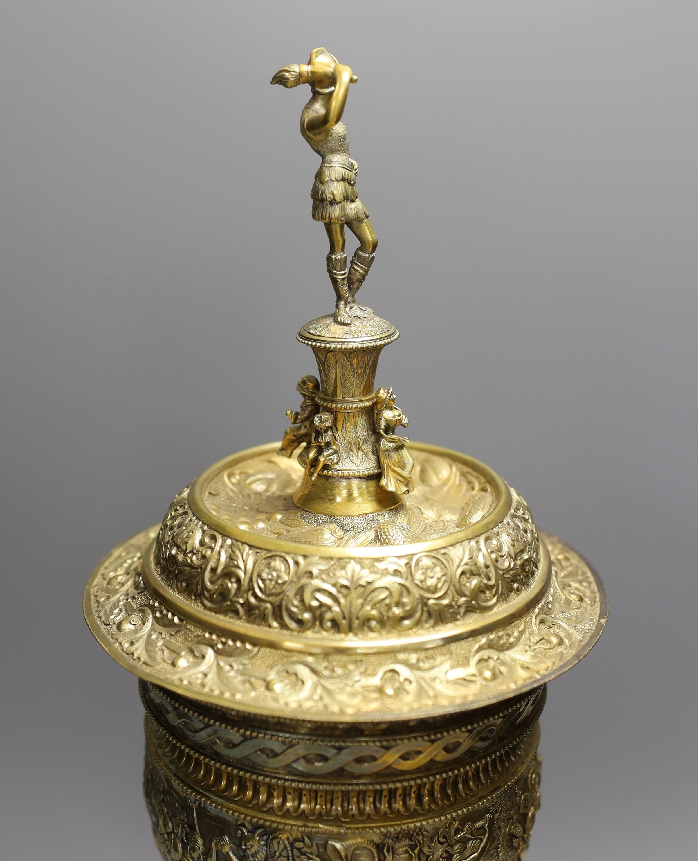 A decorative Bacchus electrotype chalice and cover on stone base - 49cm high